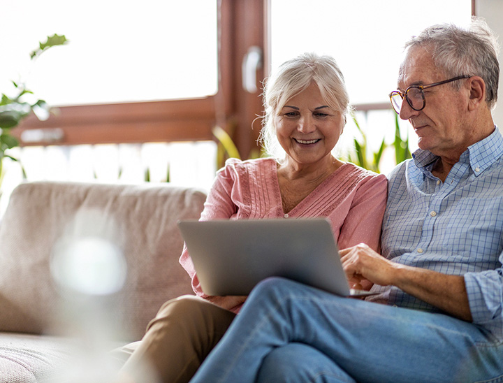 Image of an elderly couple on their sofa