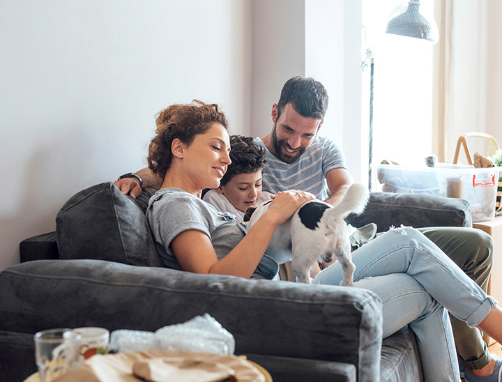 A young family and pet in their new home