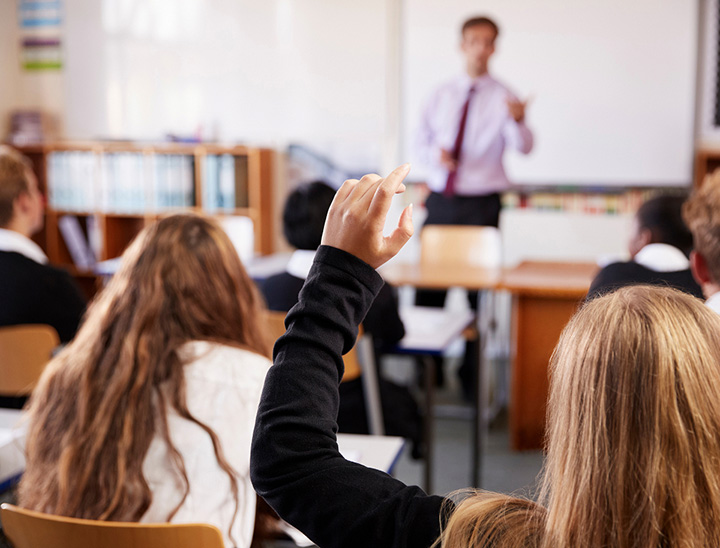 Image of students and teacher in a classroom setting